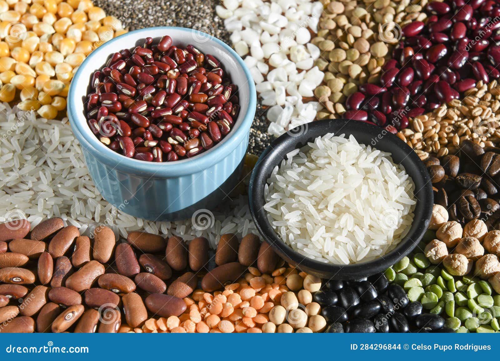Bowl with Raw White Rices and Beans on Various Seeds Grain Stock Photo