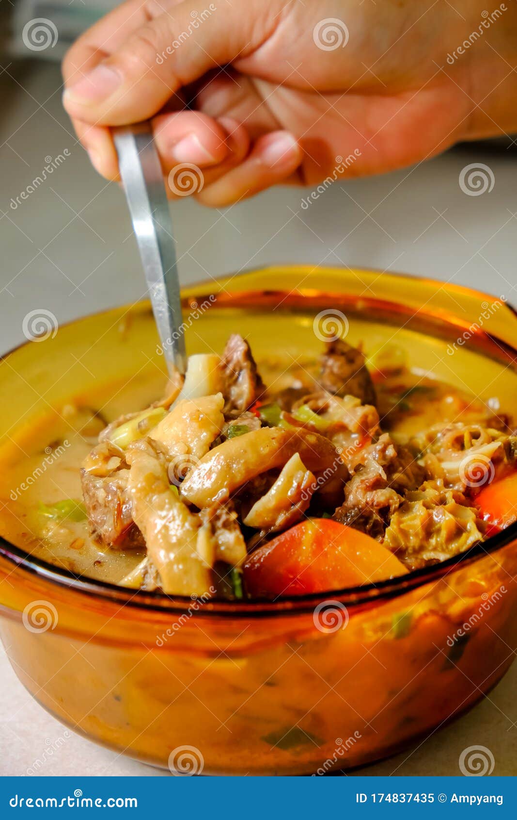 a bowl of soto betawi, indonesian native traditional soup made of beef or beef offal cooked in coconut milk broth