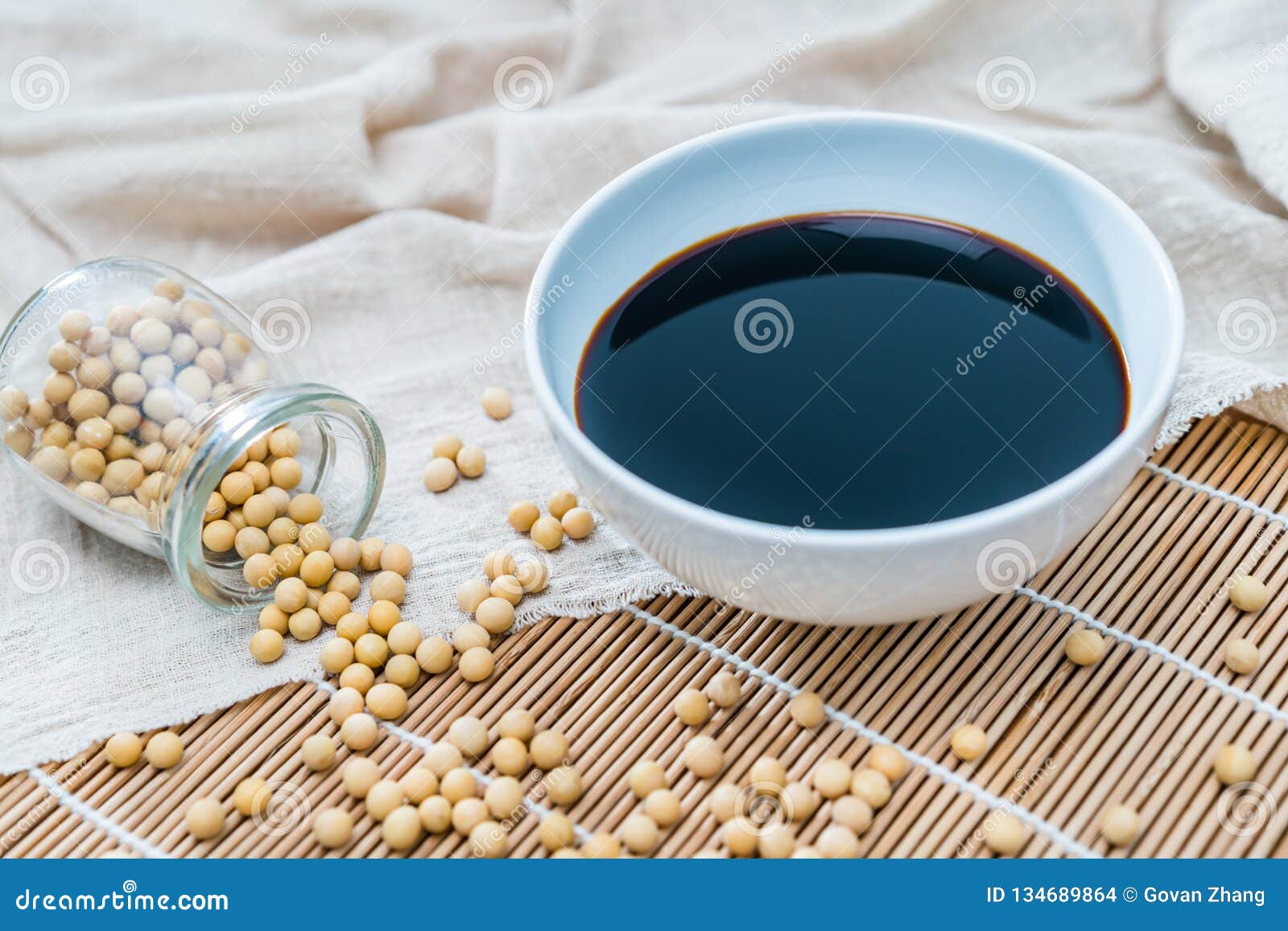 a bowl of soy sauce and sprinkled soybeans