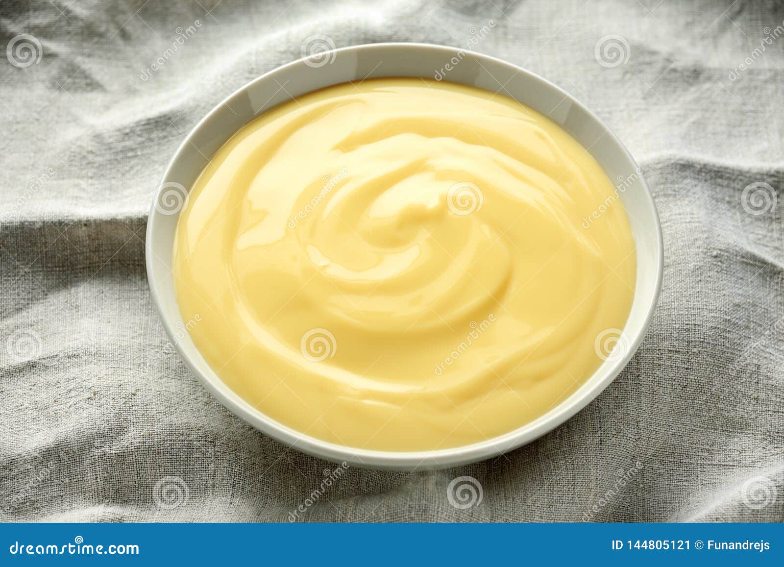bowl of vanilla custard on rustic background
