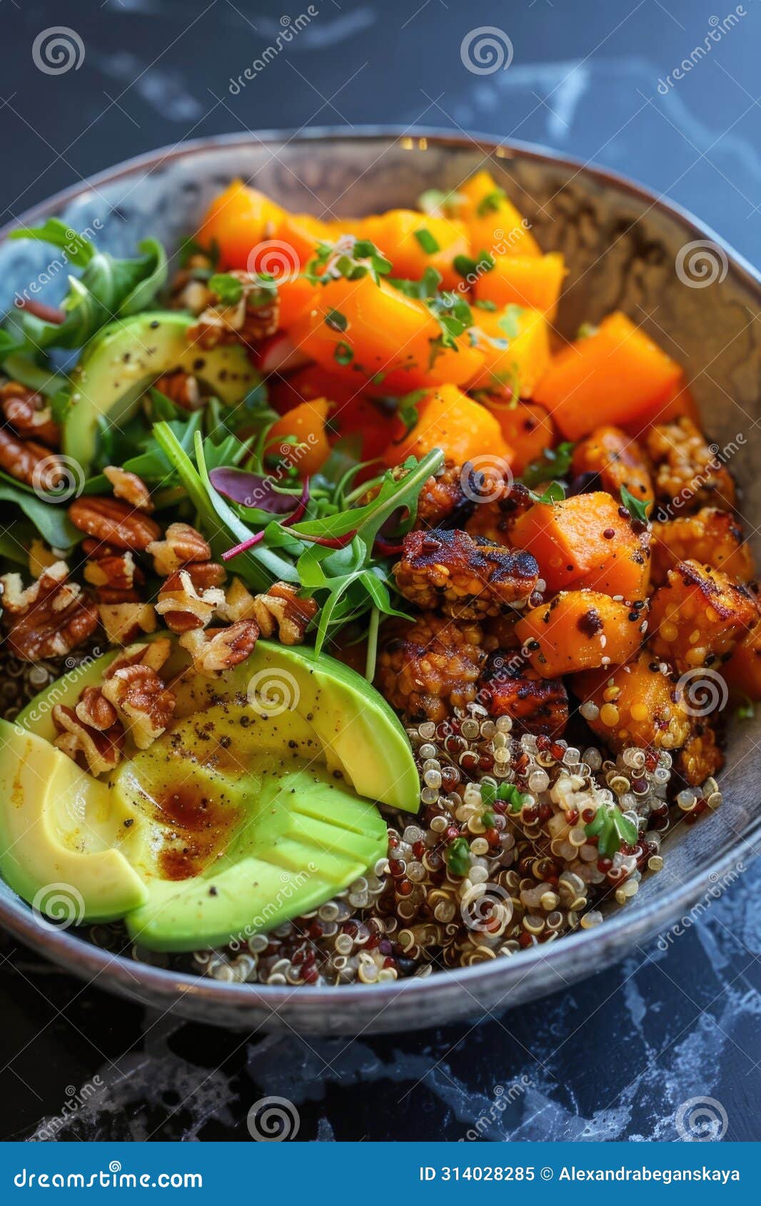 Bowl of Vegan Salad with Quinoa, Tofu, Avocado, and Mixed Greens Stock ...