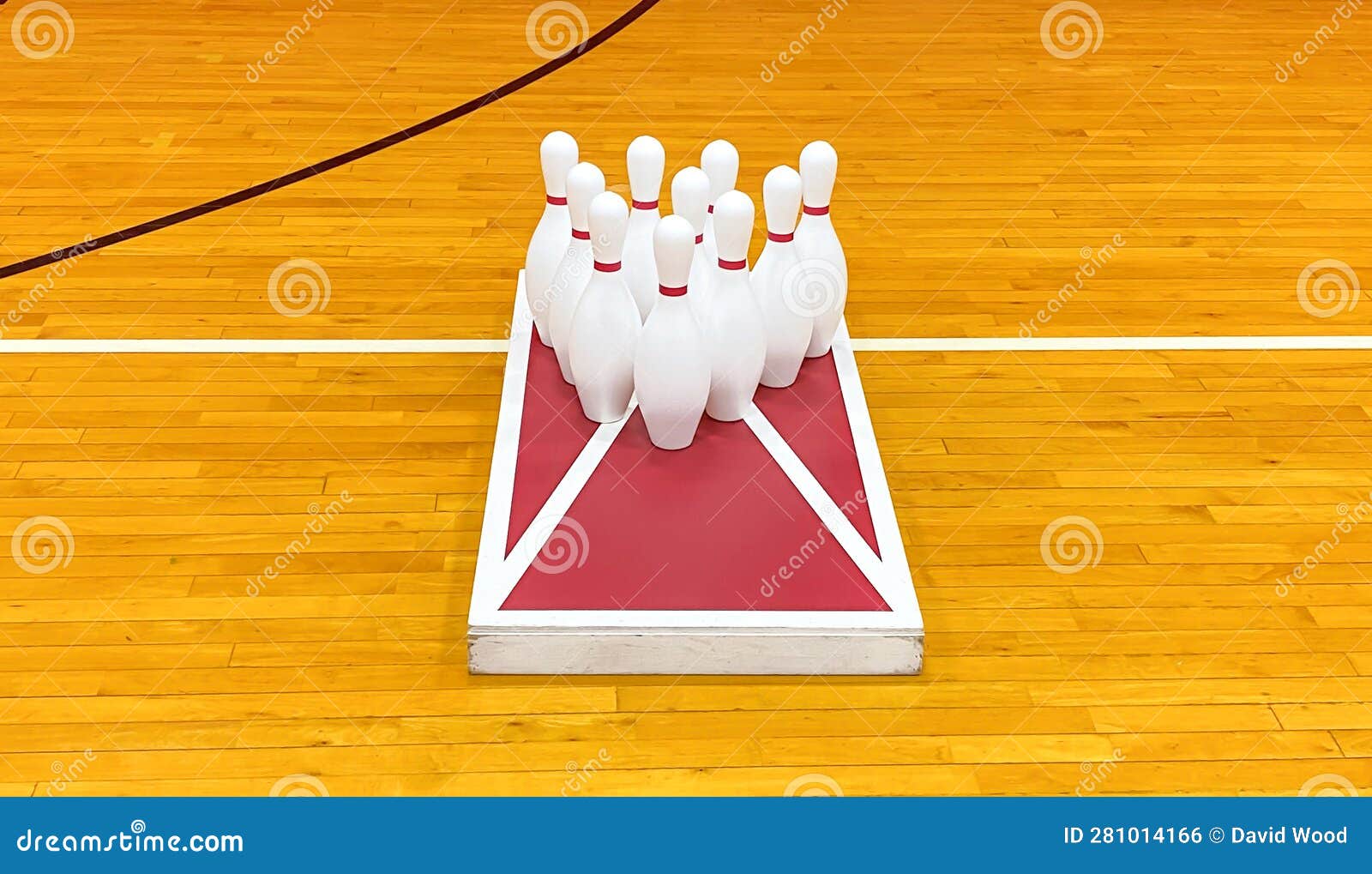 Bowling Pins on a Cornhole Game Board in a Gym for Gym Class Stock