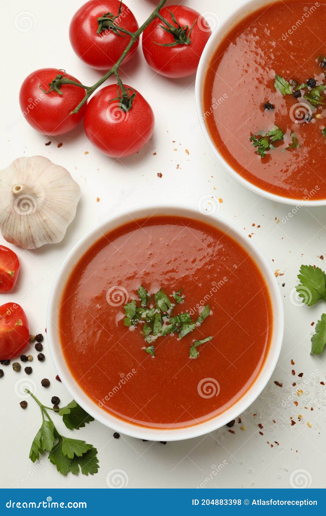 Bowls with Tomato Soup and Ingredients on White Background Stock Photo ...