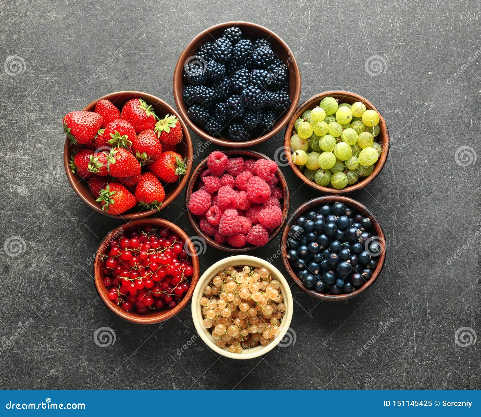 Bowls with Various Ripe Berries on Grey Background, Top View Stock