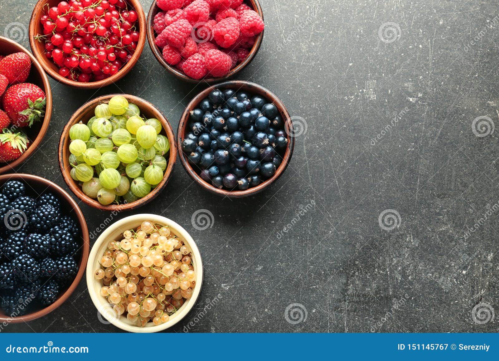 Bowls with Various Ripe Berries on Grey Background, Top View Stock