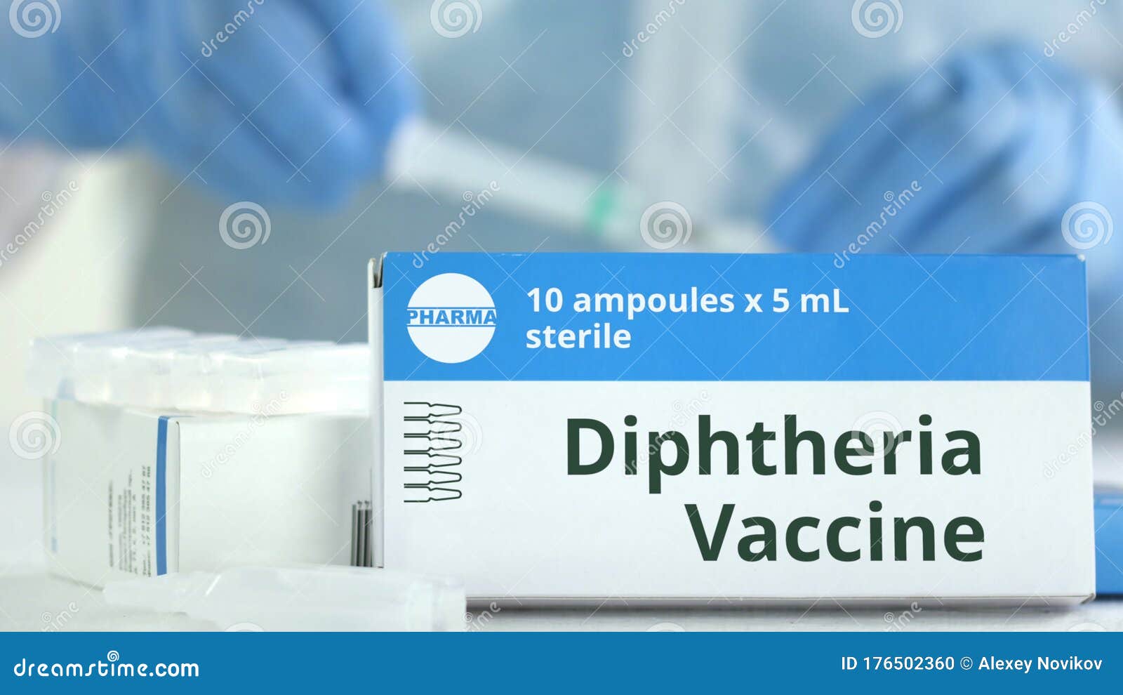 Box With Diphtheria Vaccine On The Table Against Blurred Lab Assistant Fictional Phaceutical Logo Stock Photo Image Of Diphtheria Scientific 176502360