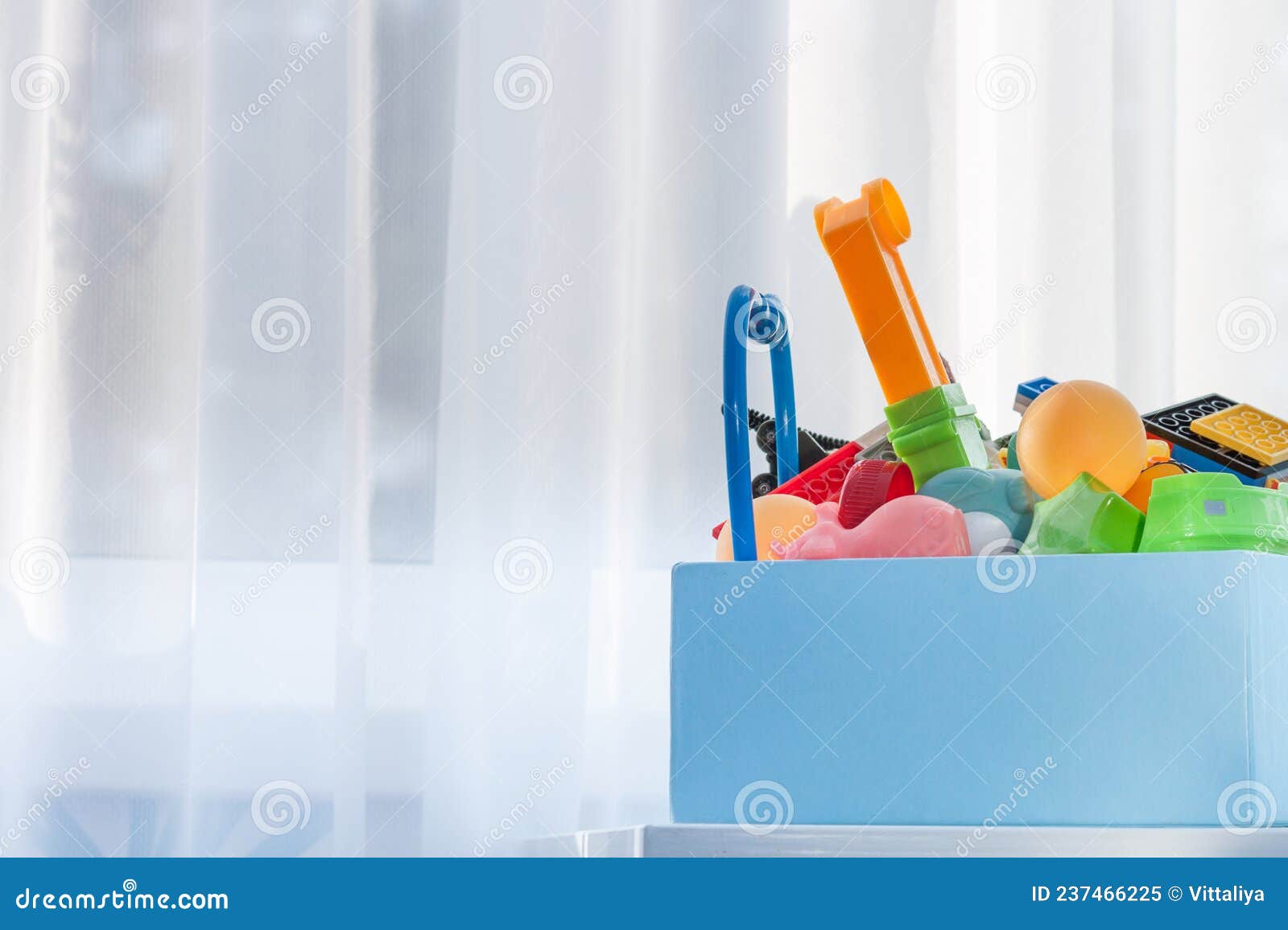 Box with Old Plastic Toys for Donate or Recycle. Copy Space Stock Image
