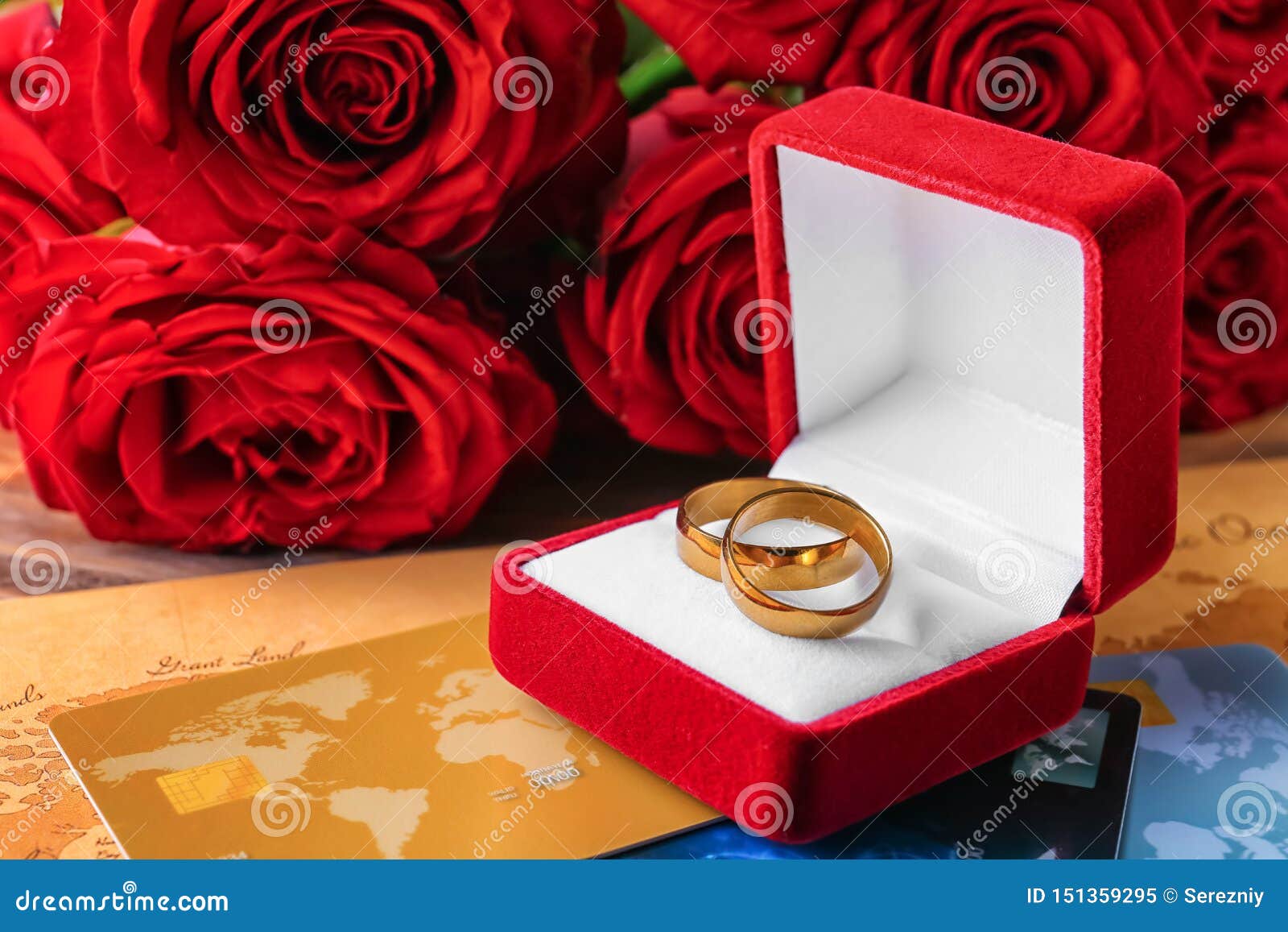 Box with Wedding Rings and Credit Cards on Table. Marriage of ...