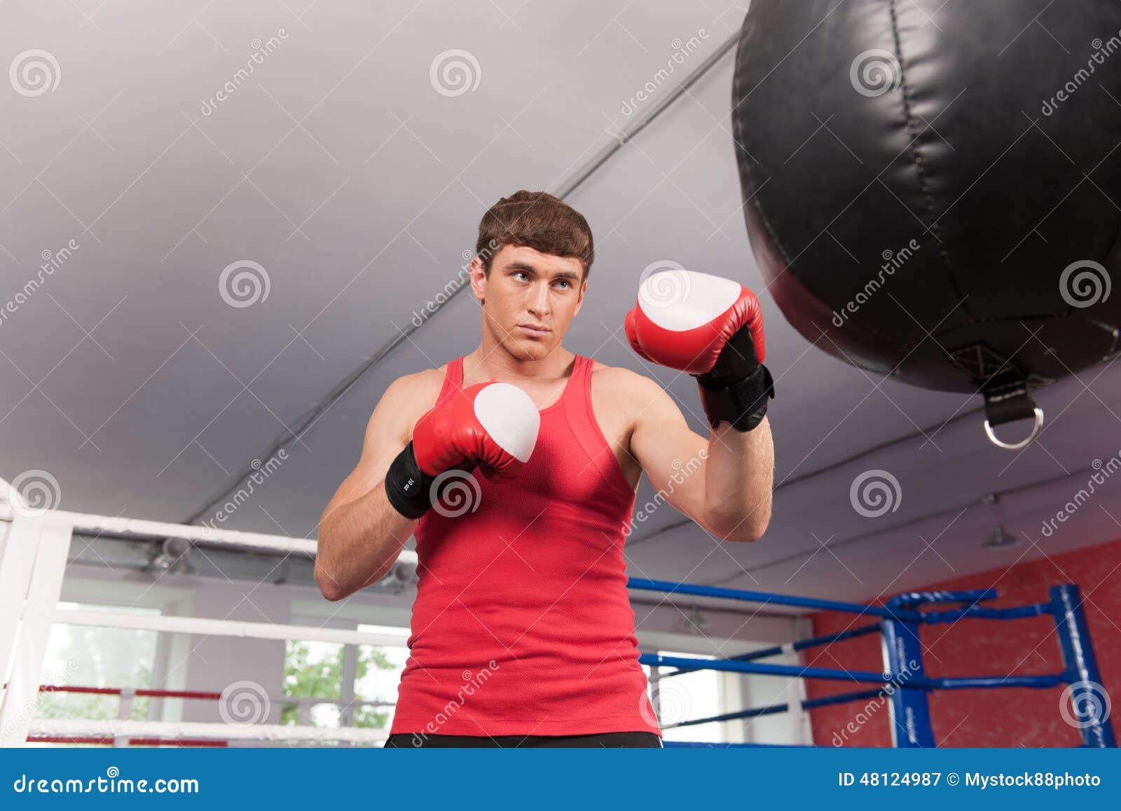 Boxer Doing Some Training on Punching Bag at Gym. Stock Image Image