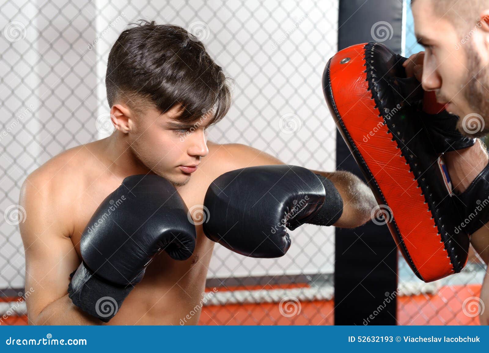 Boxer kicks punching pad stock image. Image of competition 52632193