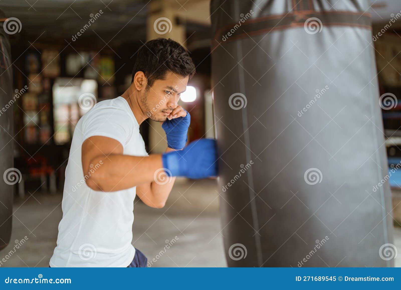 Boxer Seriously Punching the Heavy Bags in the Ring Stock Image Image