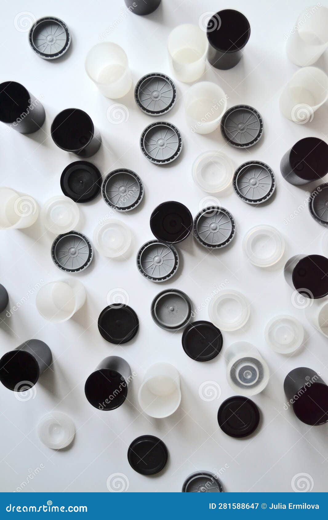 Boxes with Lids from Rolls of 35mm Negative Film on White Background