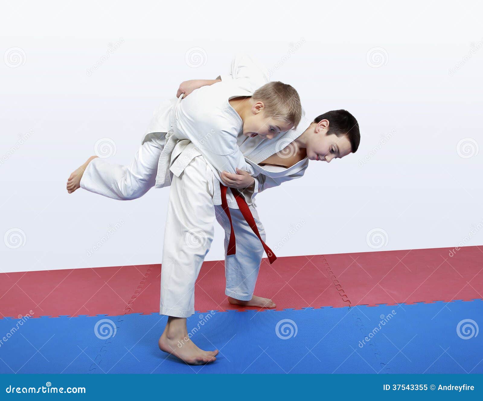 Boy Athlete with a Red Sash Makes Hip Throw Stock Image Image of judo