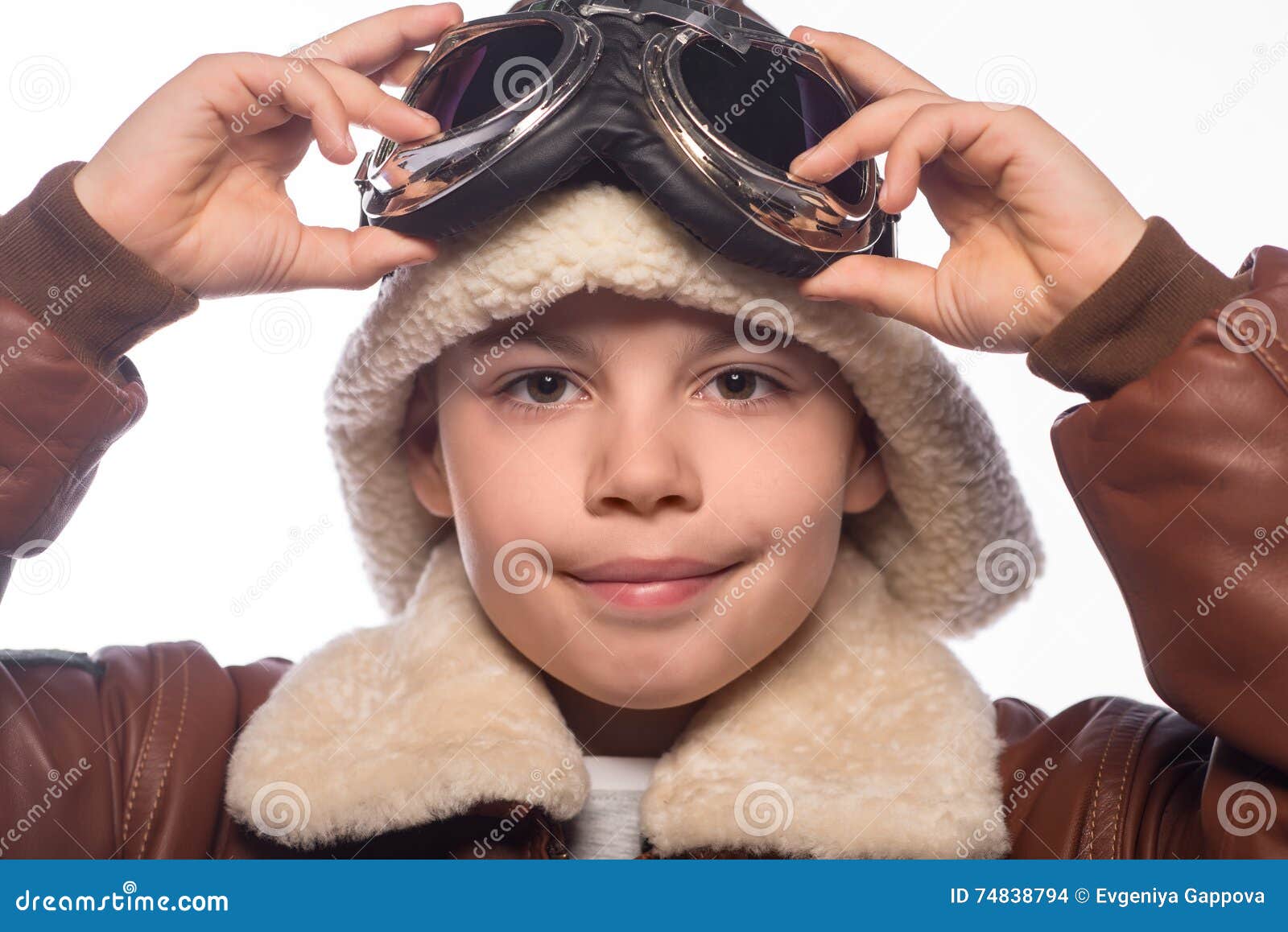 The Boy is an Aviator in the Jacket of the Pilot and in Old Glasses