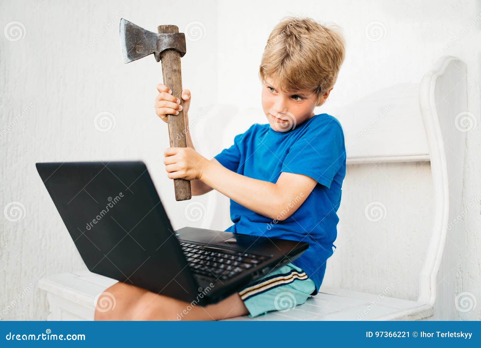 a boy with an ax and a laptop