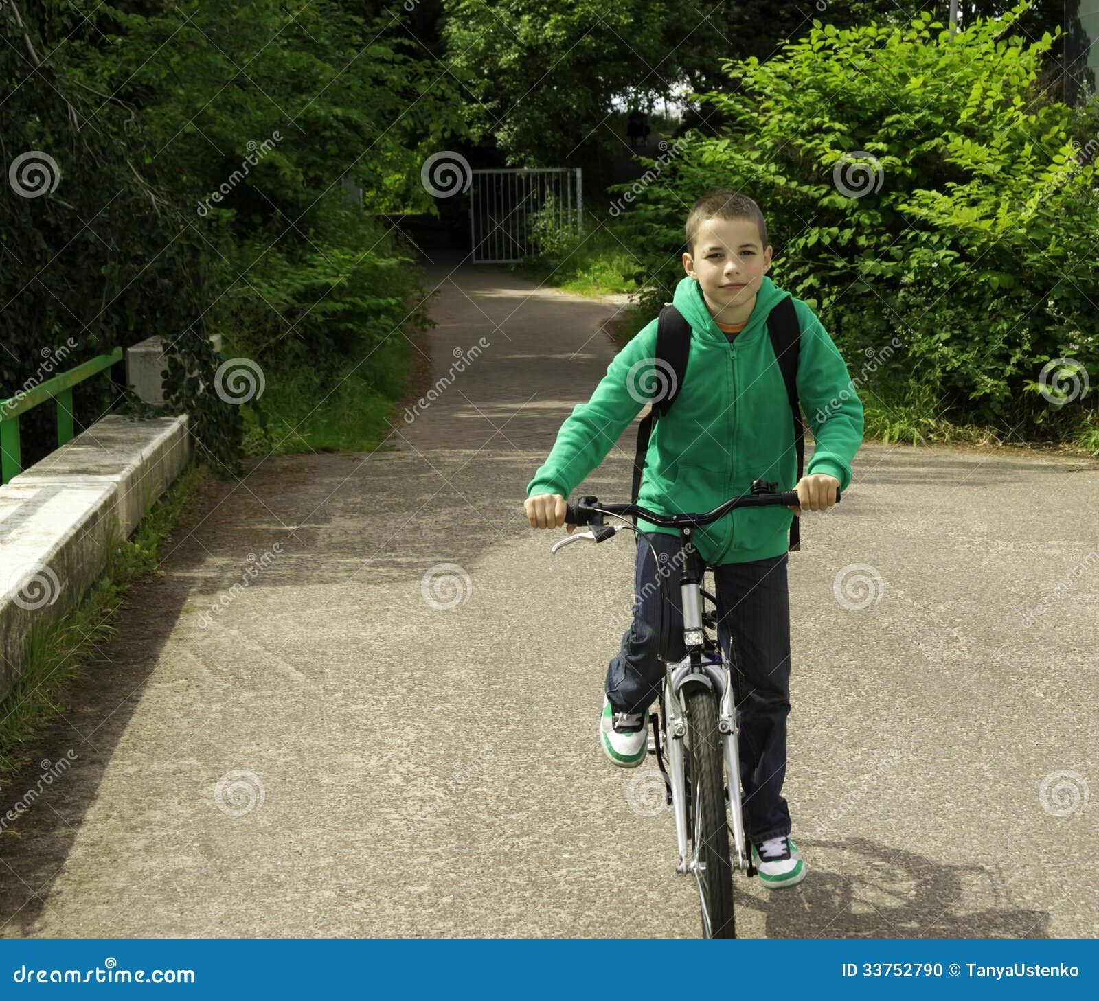 Boy With Backpack On A Bicycle Stock Photo Image of cheerful