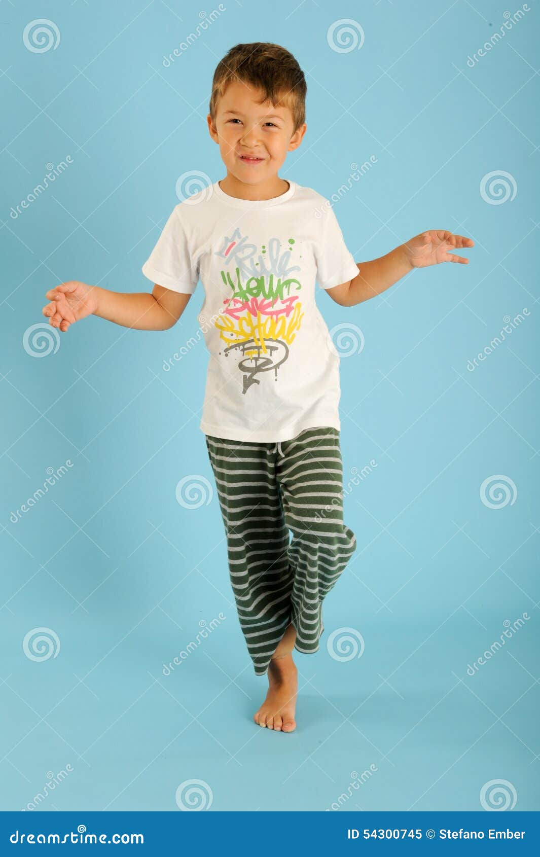 Boy in balance on one foot stock image. Image of child - 54300745