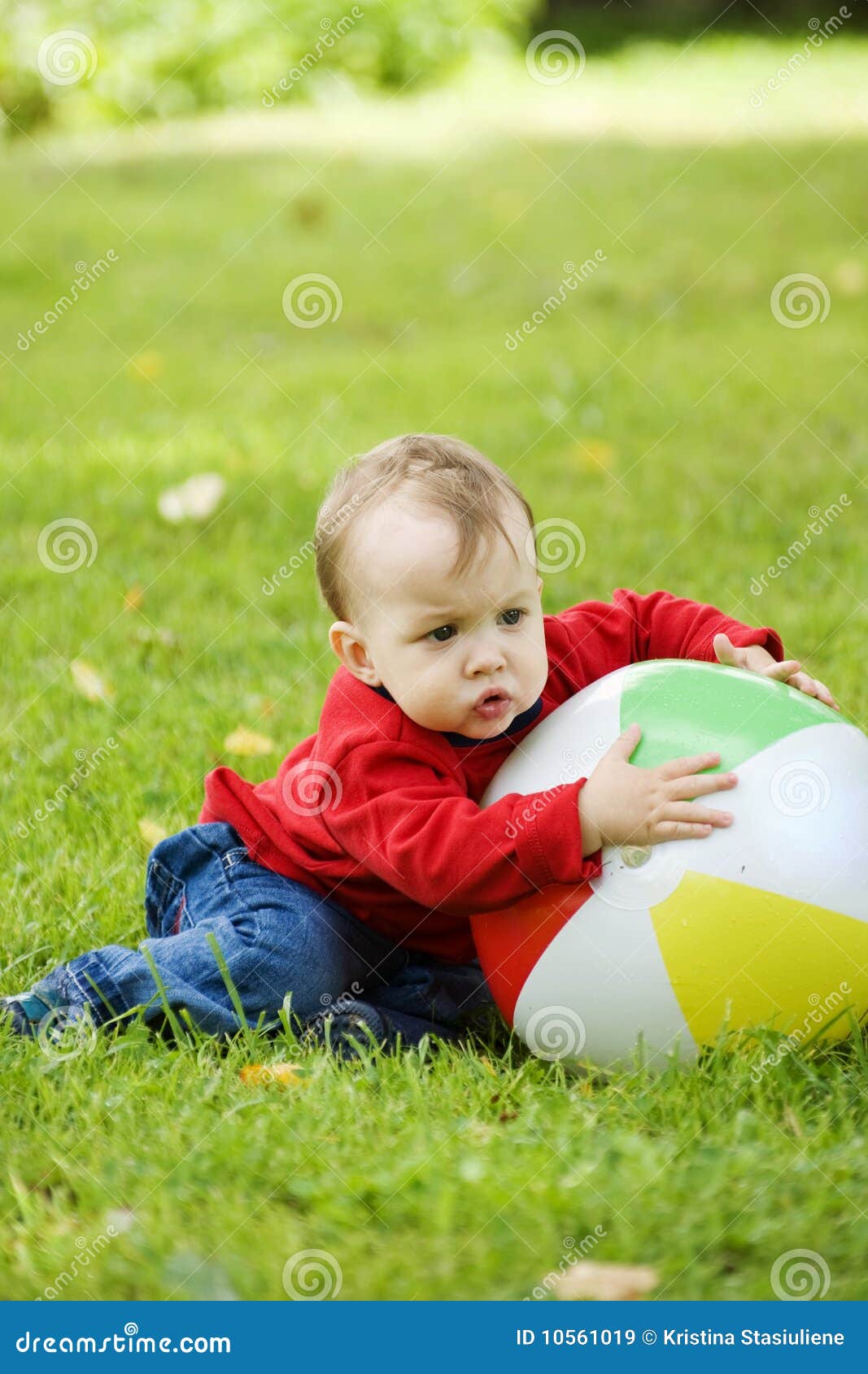 Little Boy With A Big Ball. RoyaltyFree Stock Photography