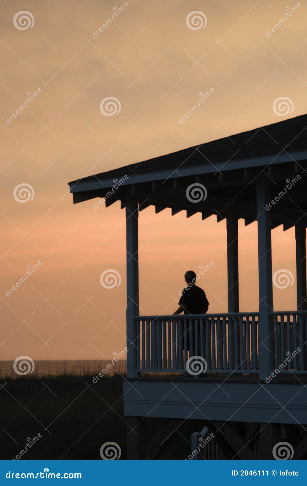 boy on beachfront porch