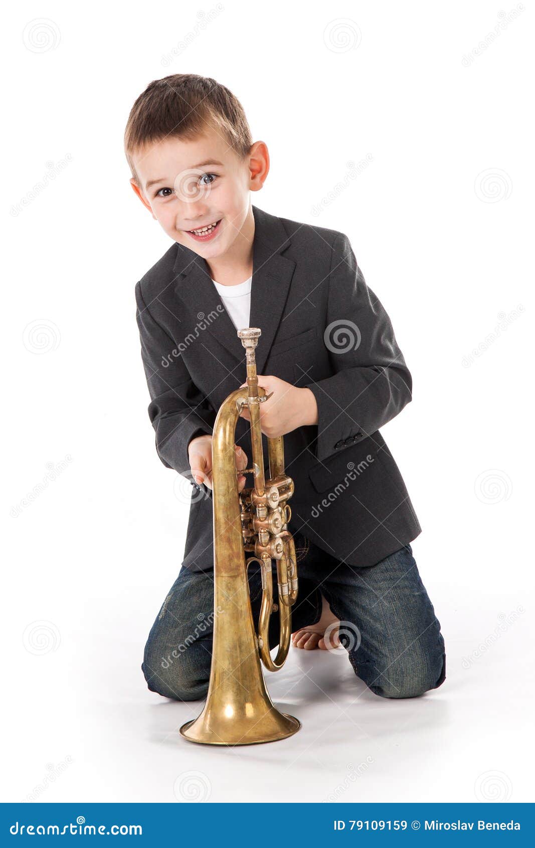Boy Blowing into a Trumpet Against White Background Stock Image Image