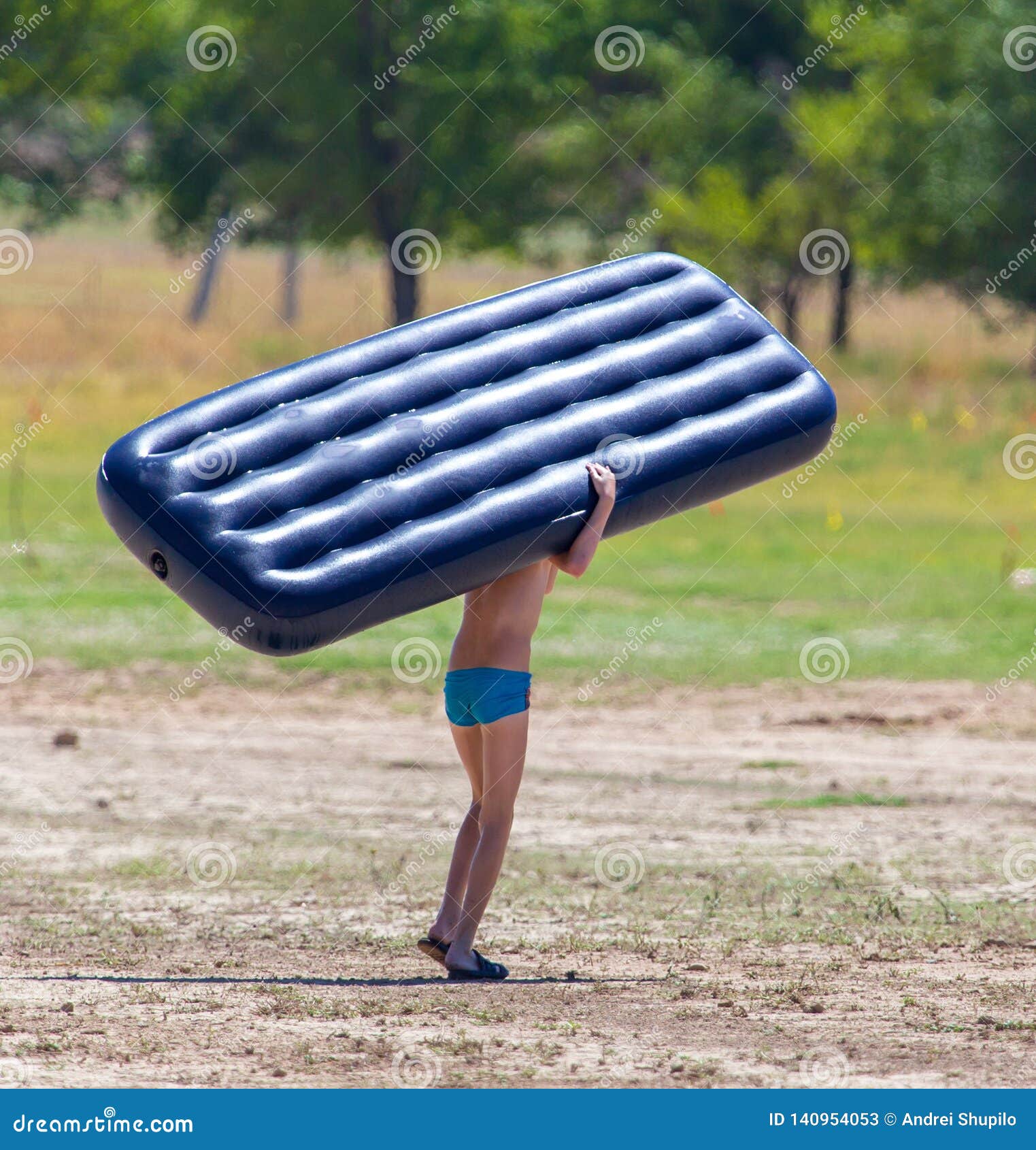 The Boy Carries an Air Mattress on the Beach Stock Image Image of