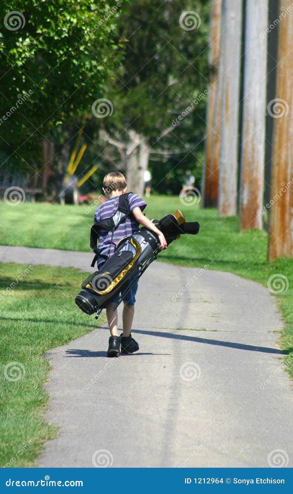 Boy Carrying Bag stock photo. Image of putter, chipping 1212964