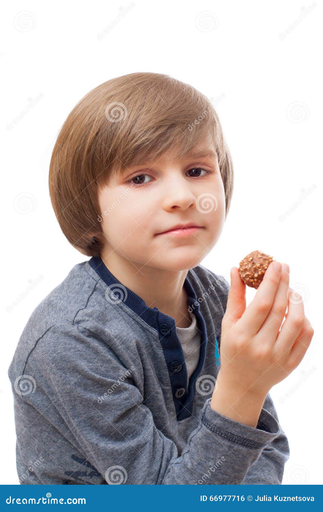 Boy with chocolate candy stock photo. Image of milk, hand 66977716