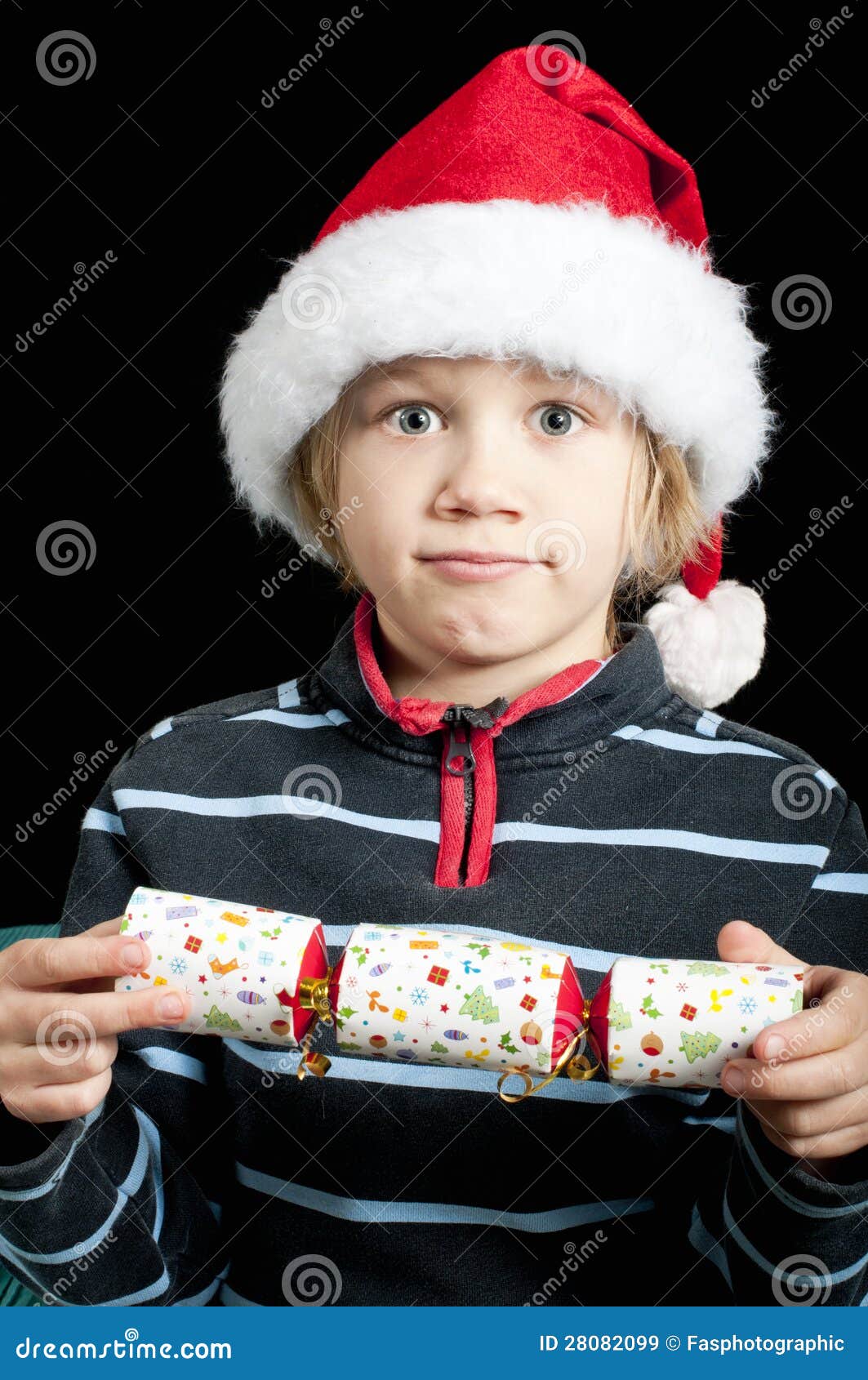 Boy with christmas cracker stock image. Image of tradition 28082099