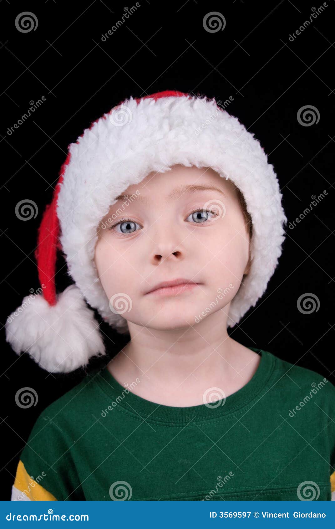 Boy in Christmas hat stock image. Image of christmas, entertainment