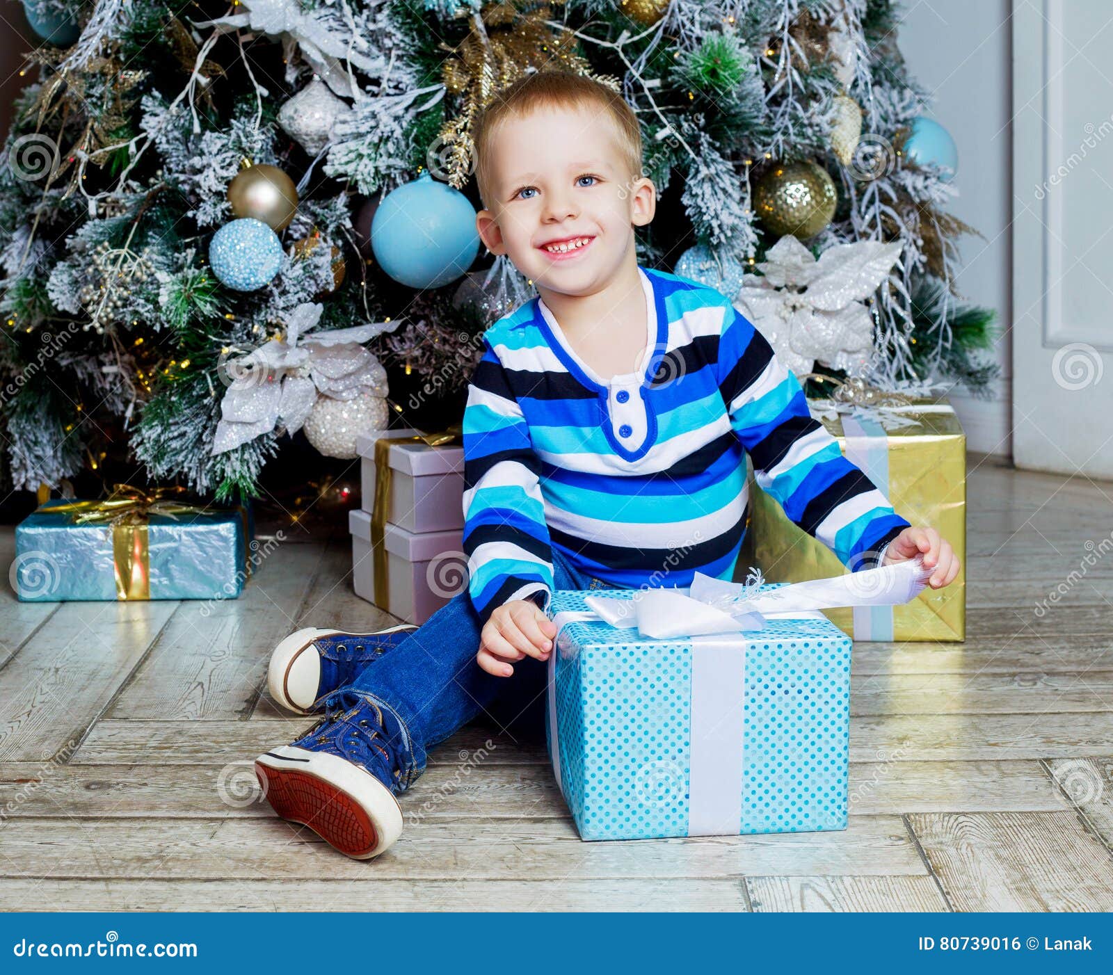 Boy with Christmas tree stock photo. Image of female 80739016