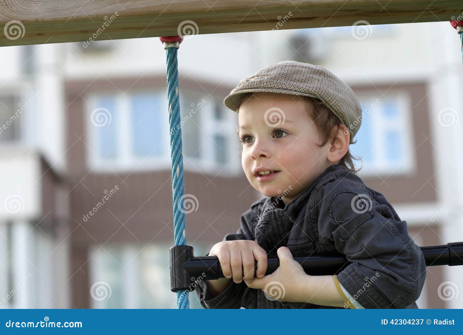 Boy climbing a rope ladder stock image. Image of agility 42304237