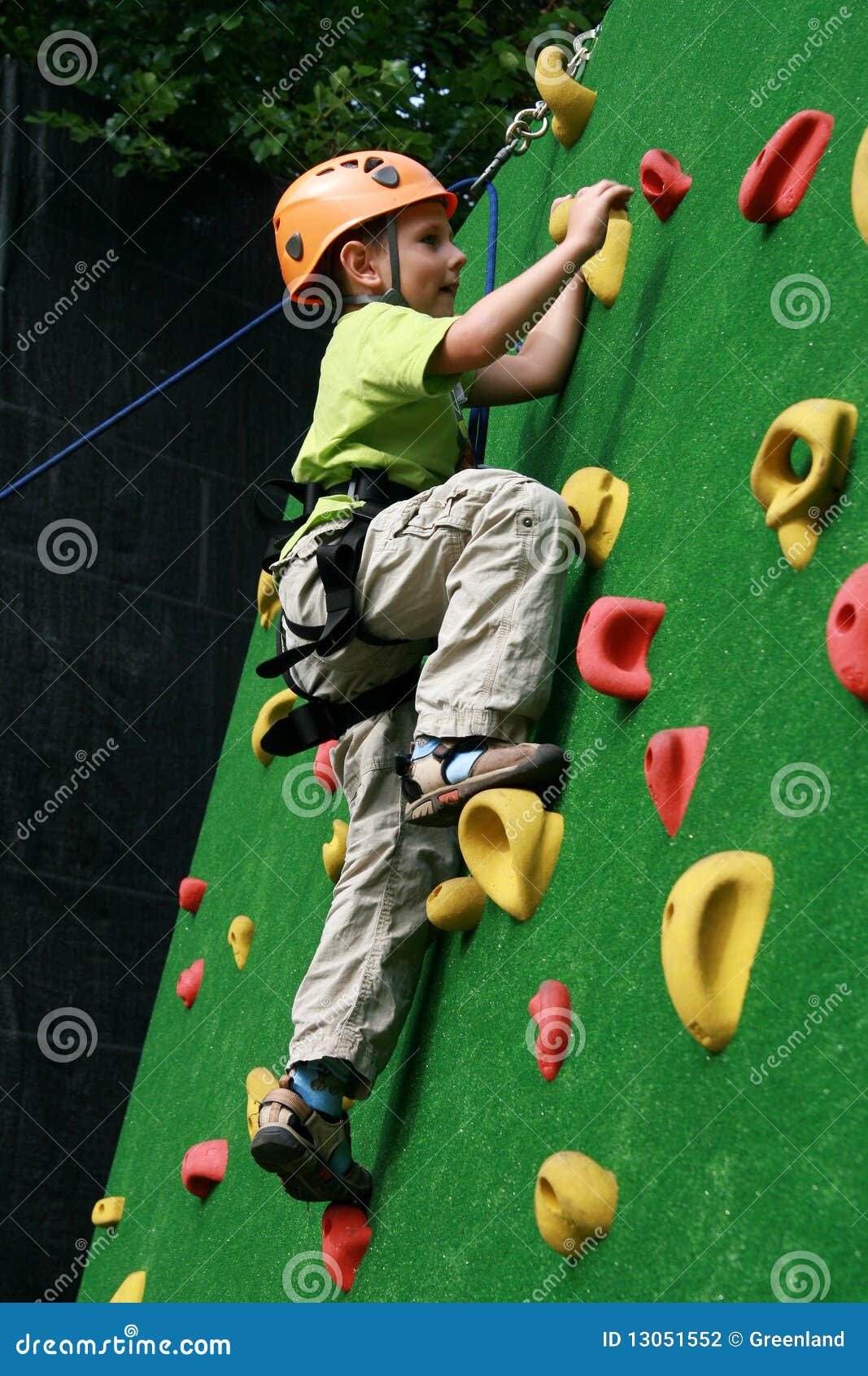 boy on climbing wall