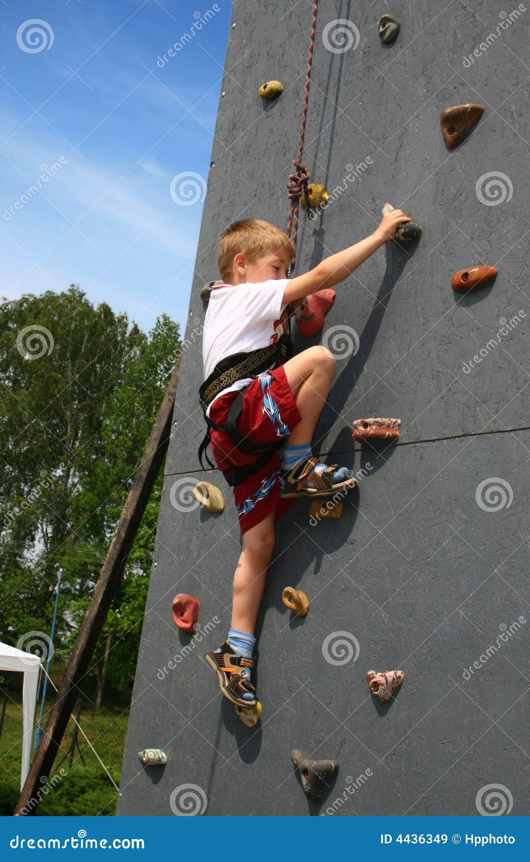 Boy on climbing wall stock image. Image of effort, playful 4436349