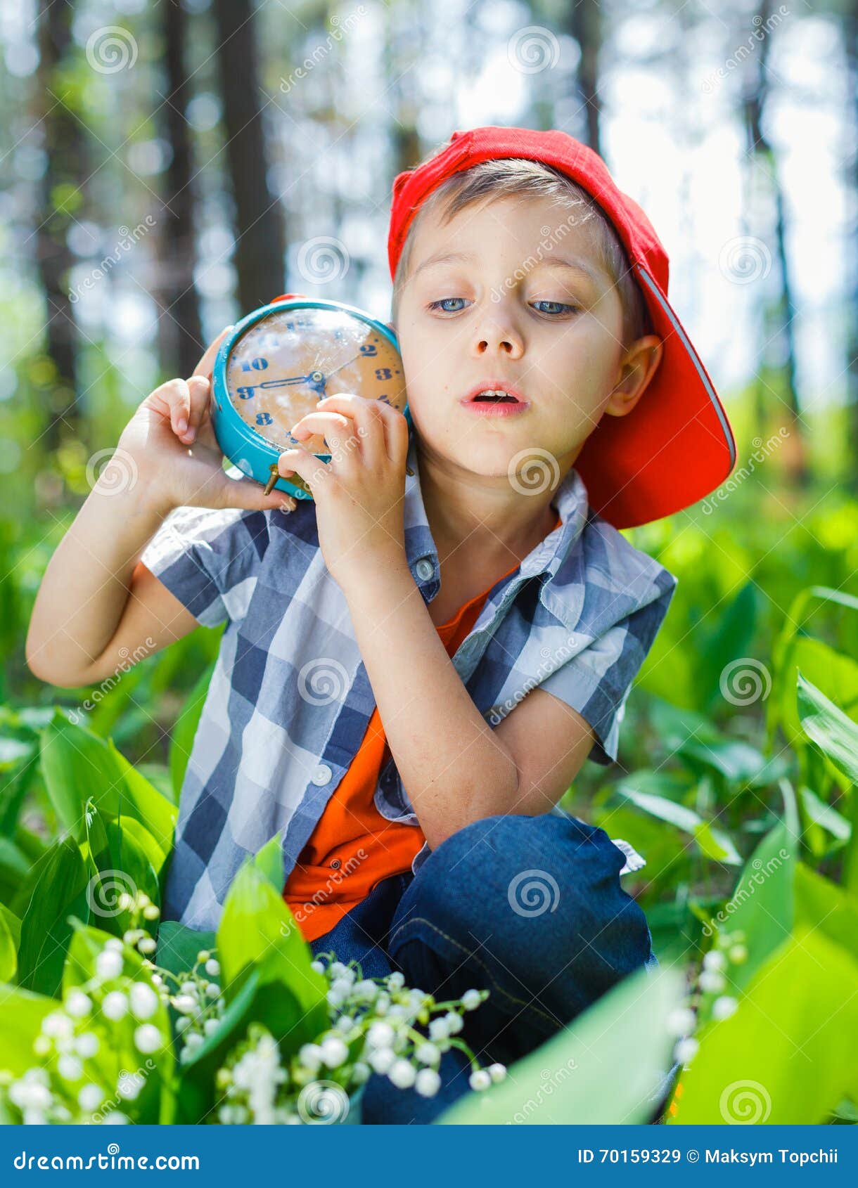Boy with a clock stock image. Image of happiness, little 70159329