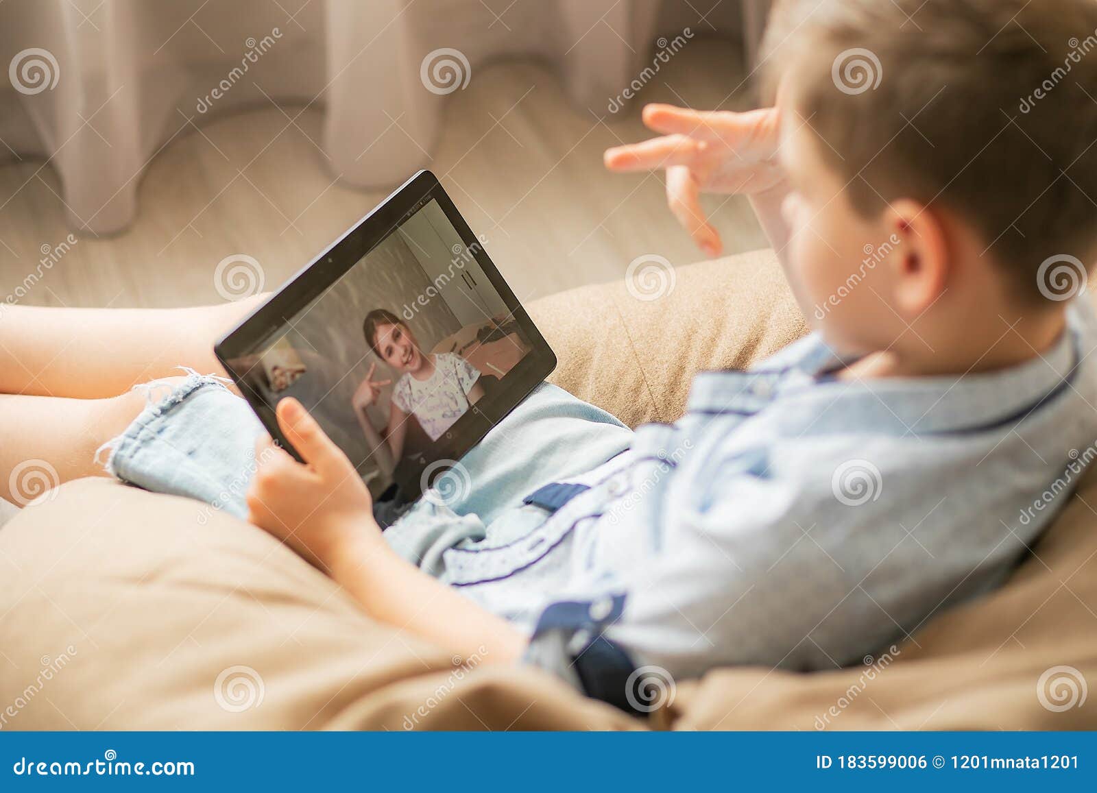 The Boy Communicates with His Girlfriend Online. Children Play a