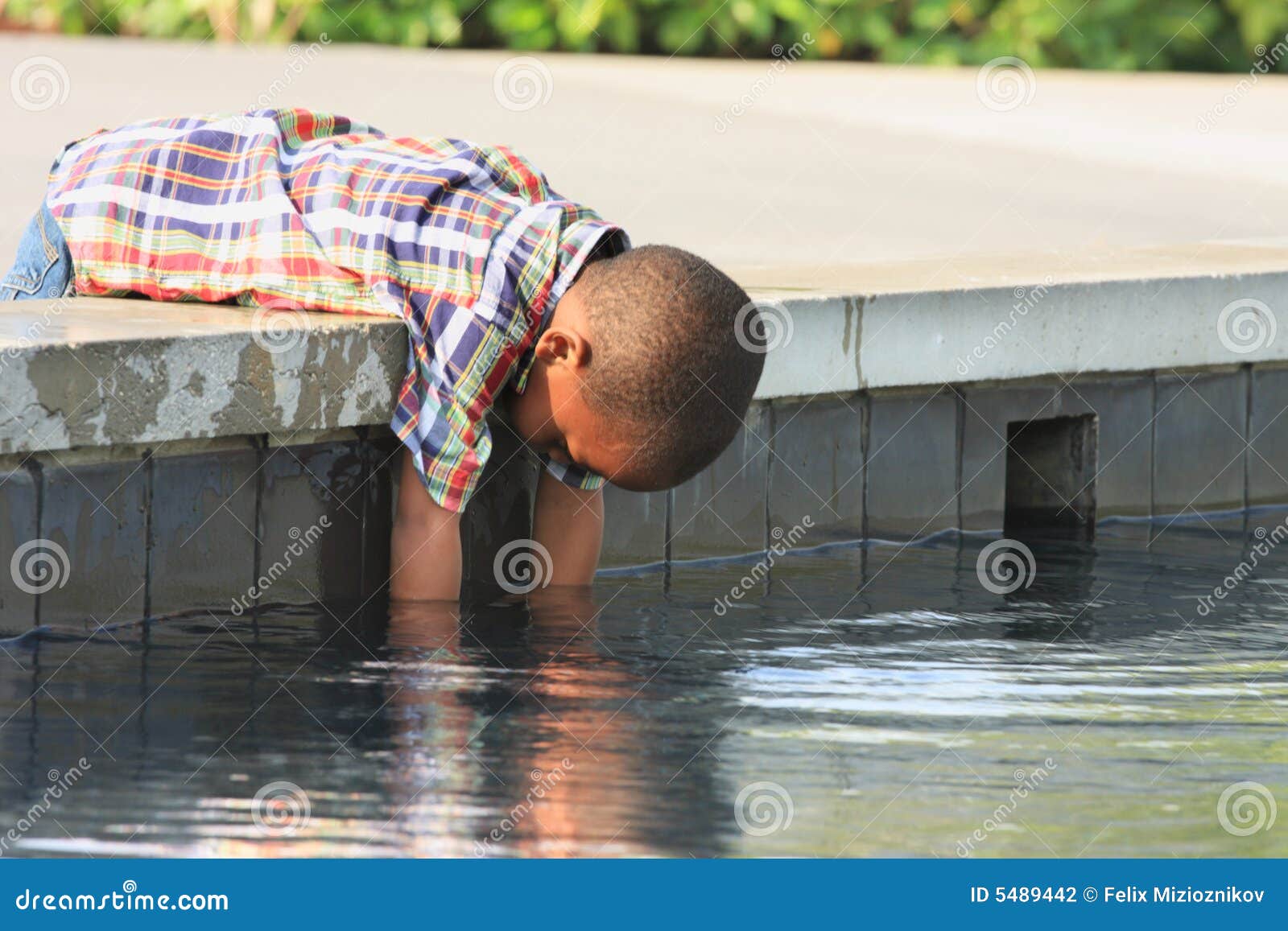 Boy Cooling of his Hands stock photo. Image of black, child 5489442