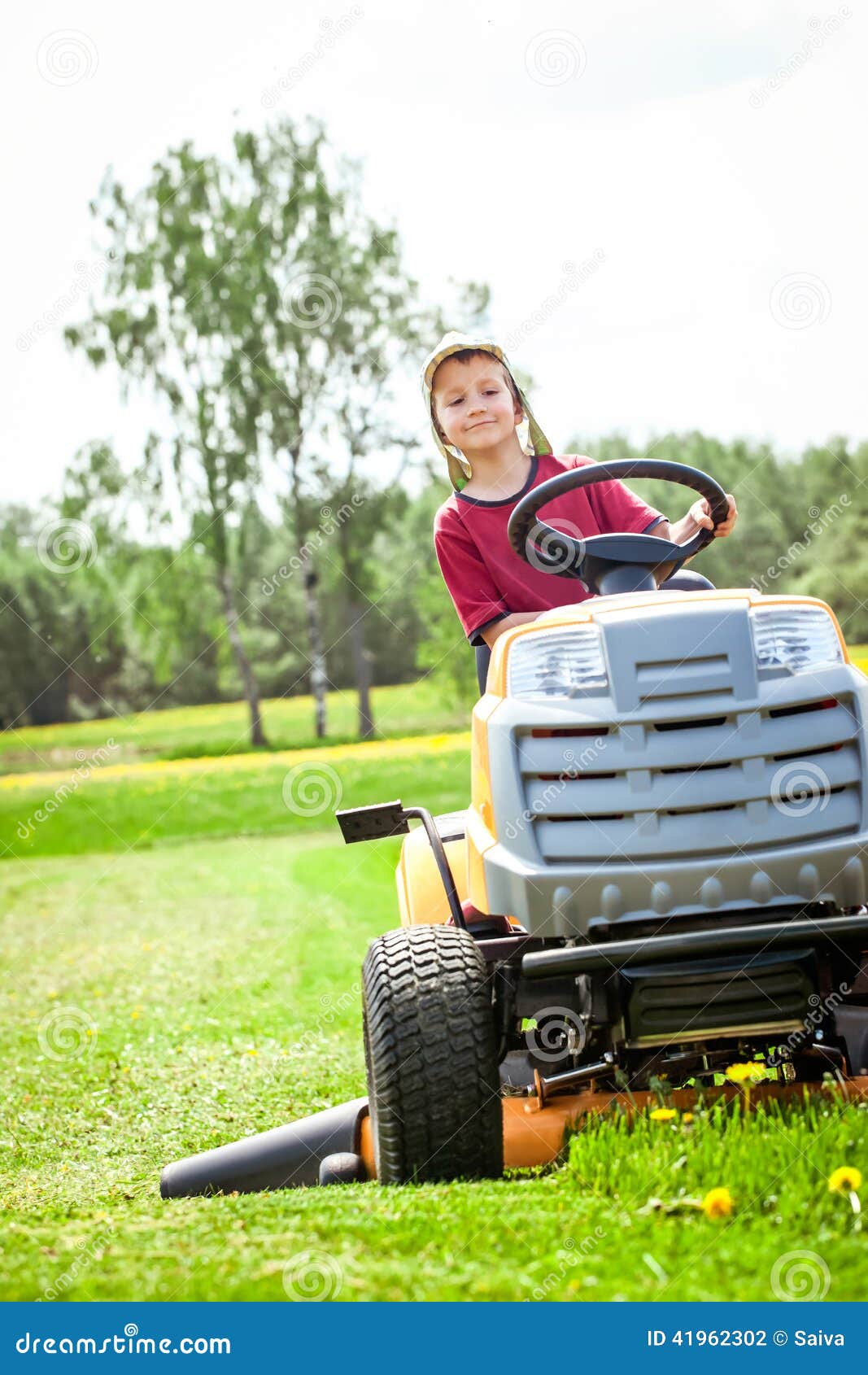Boy cutting the grass stock photo. Image of country, lawn 41962302
