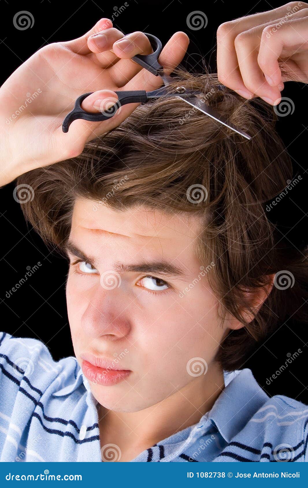 Boy cutting his hair 2 stock photo. Image of hairdressing 