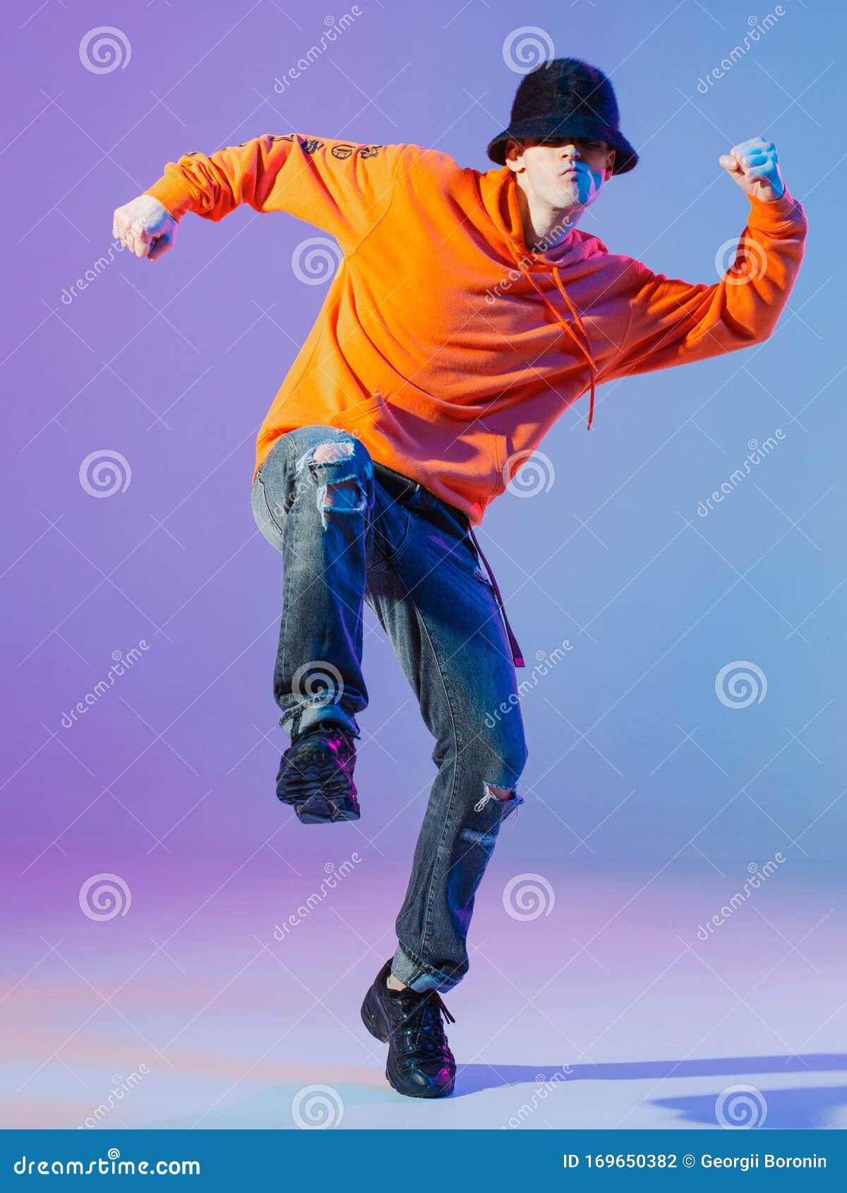 Boy Dancing Contemporary Dance in Studio. Breakdancing. Stock Photo