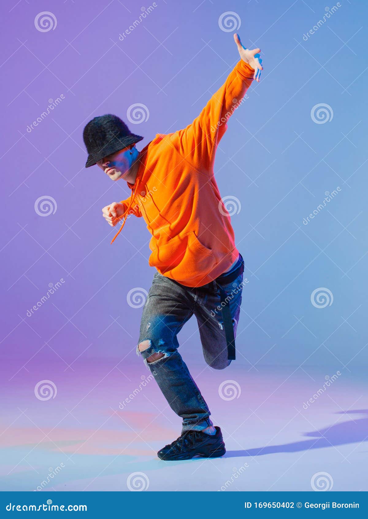 Boy Dancing Contemporary Dance in Studio. Breakdancing. Stock Photo