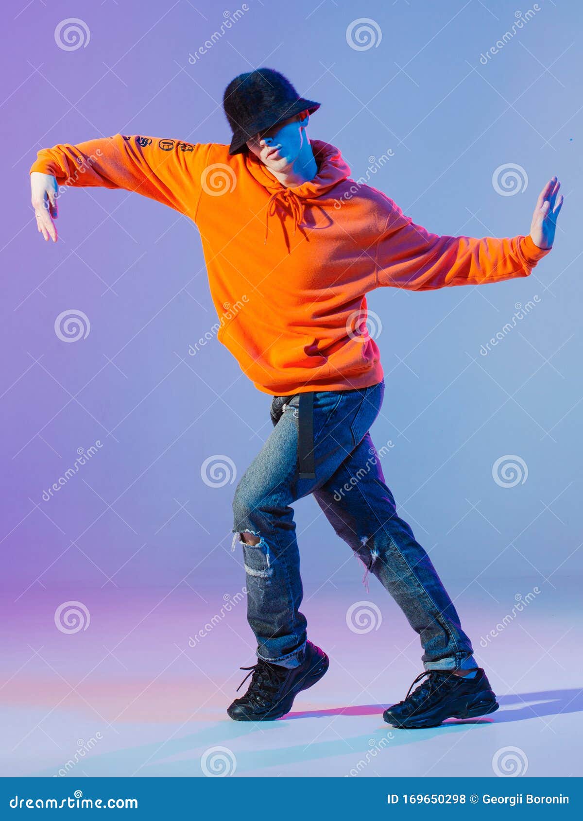 Boy Dancing Contemporary Dance in Studio. Breakdancing. Stock Photo