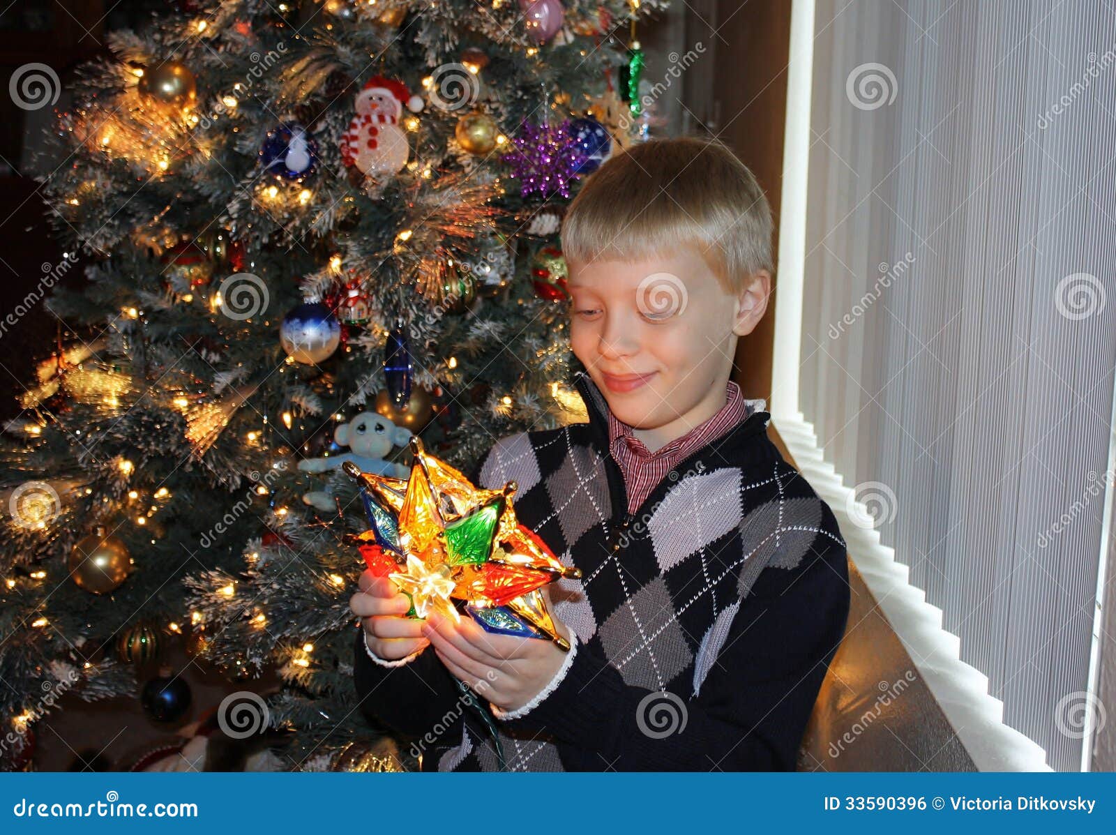 A Boy Decorating Christmas Tree Stock Photo Image of child, decorating 33590396