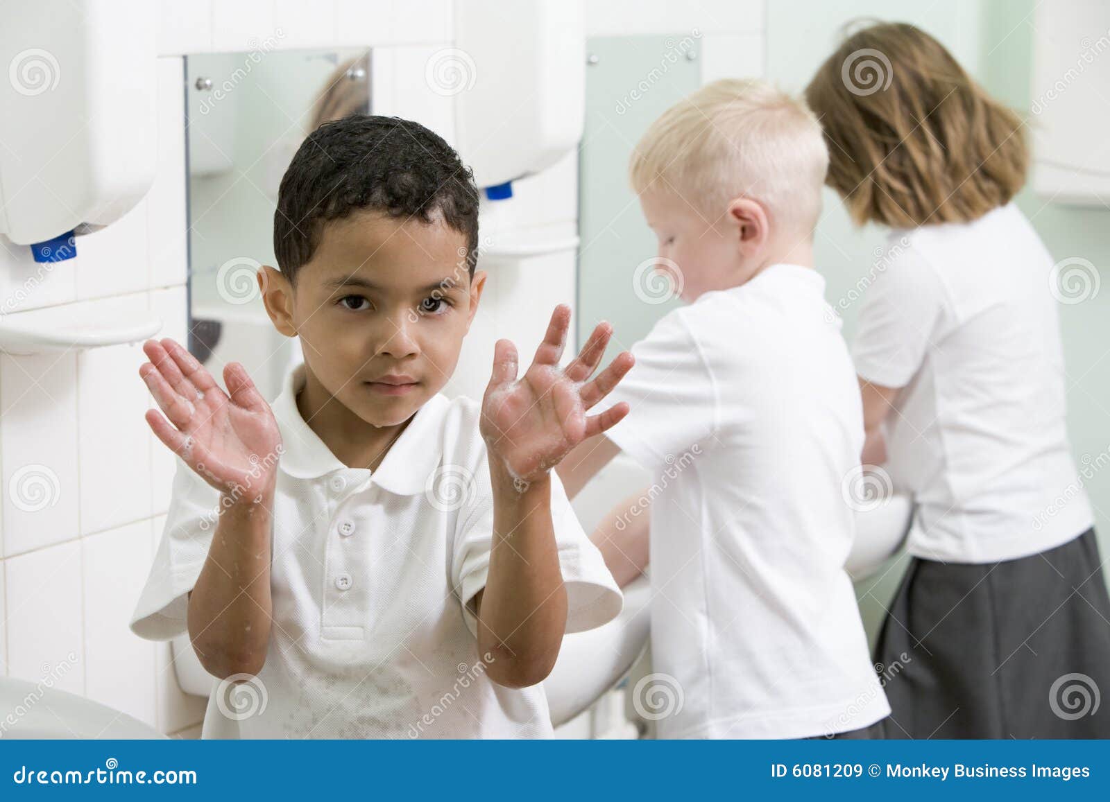 A Boy Displaying His Hands in a School Bathroom Stock Image Image of