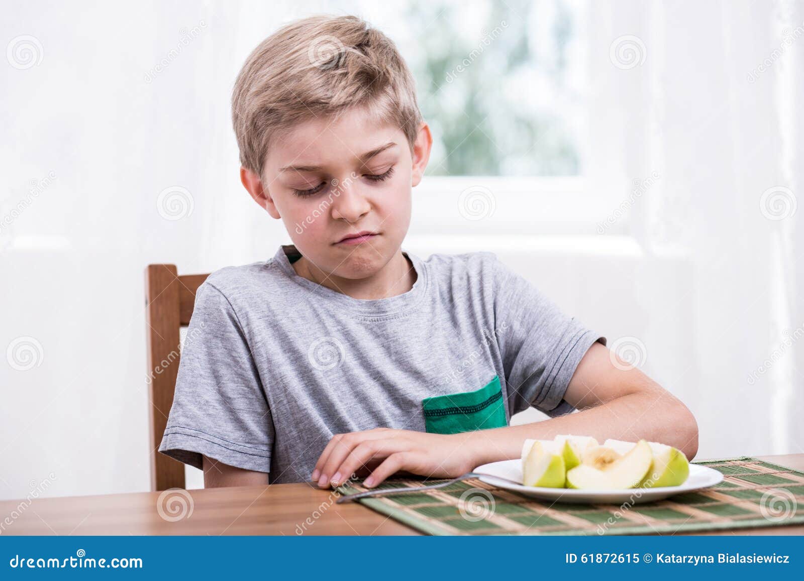 Boy doesn t like fruit stock image. Image of plate, food 61872615