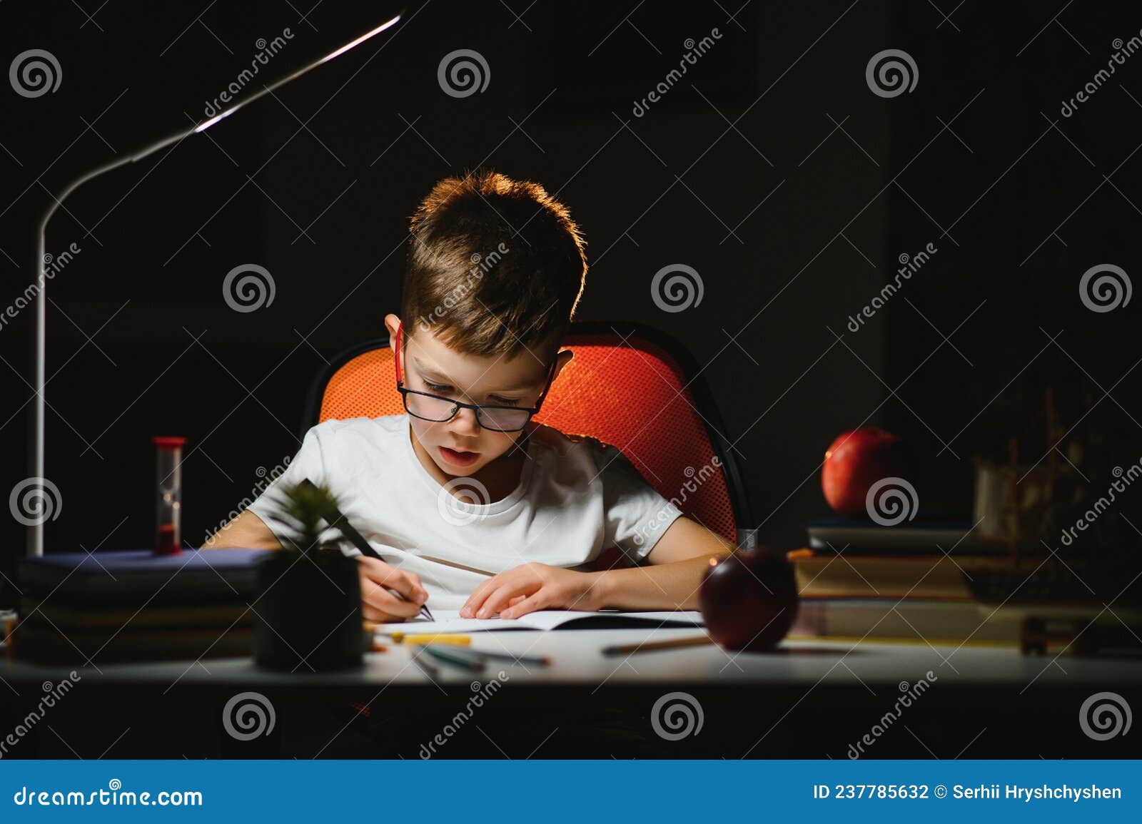 he does his homework in the evening