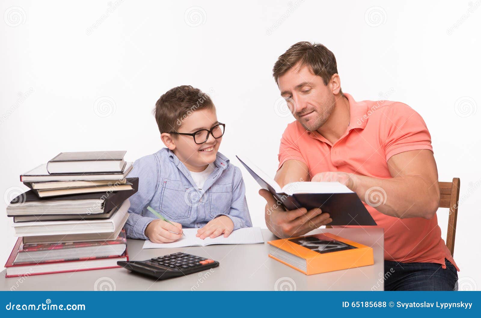 Boy Doing Homework Together with His Father Stock Photo - Image of