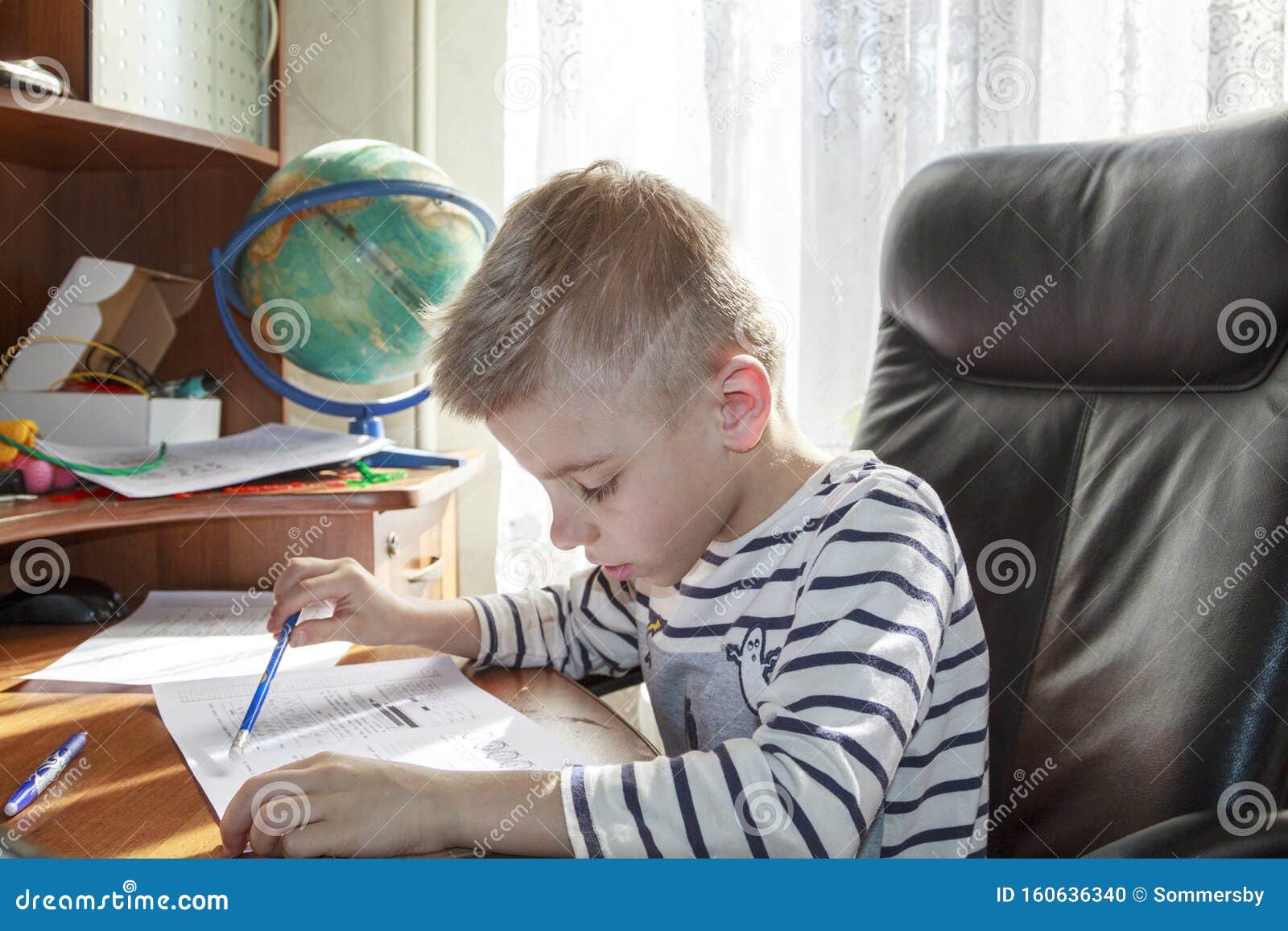 boy doing math homework