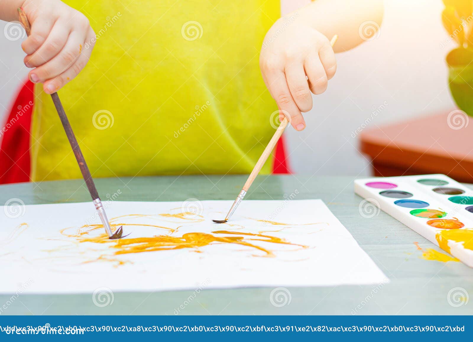 The Boy Draws with Paints . Sit at Home. the Remote Training