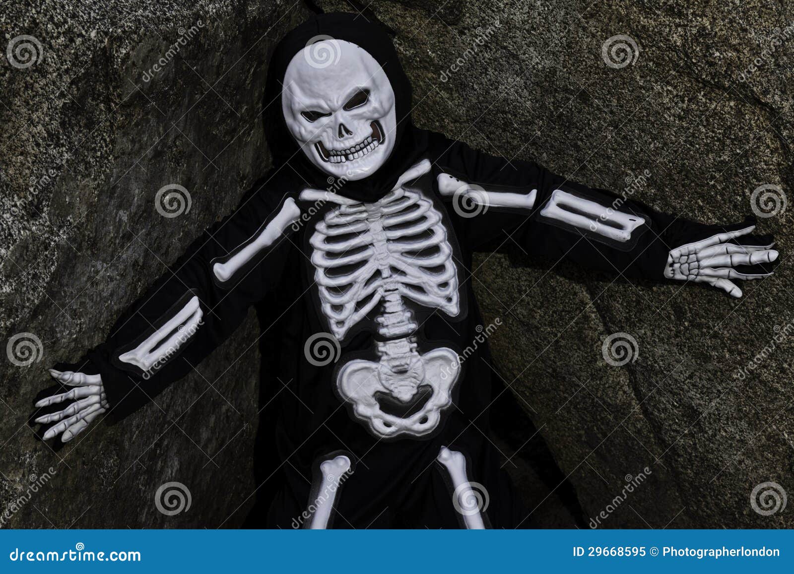 Boy Dressed Up As Skeleton Posing on Rock Stock Image Image of
