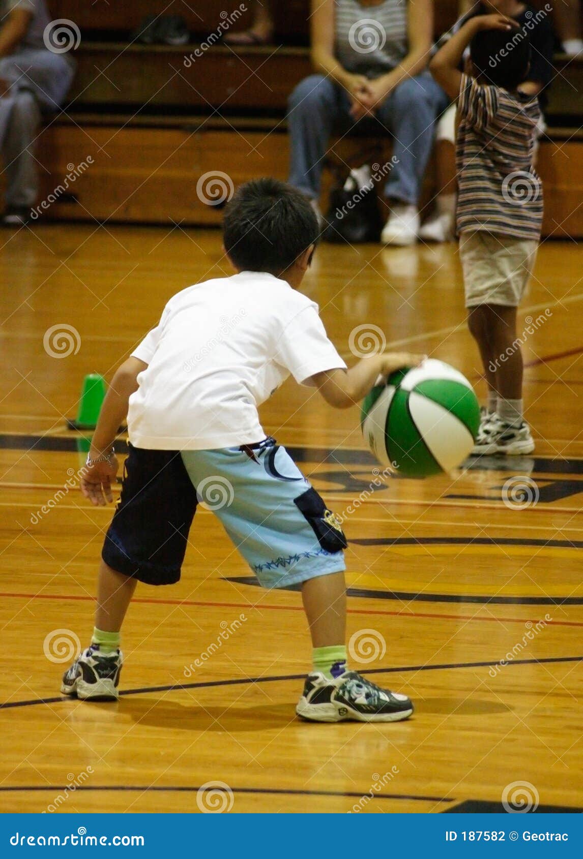 Boy dribbling basketball stock photo. Image of basketball 187582